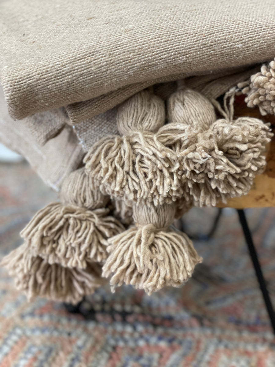 Handwoven Moroccan Cotton Pom Pom Throw in Camel Holdingforth